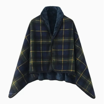 Plaid poncho with blue and green pattern on a white background